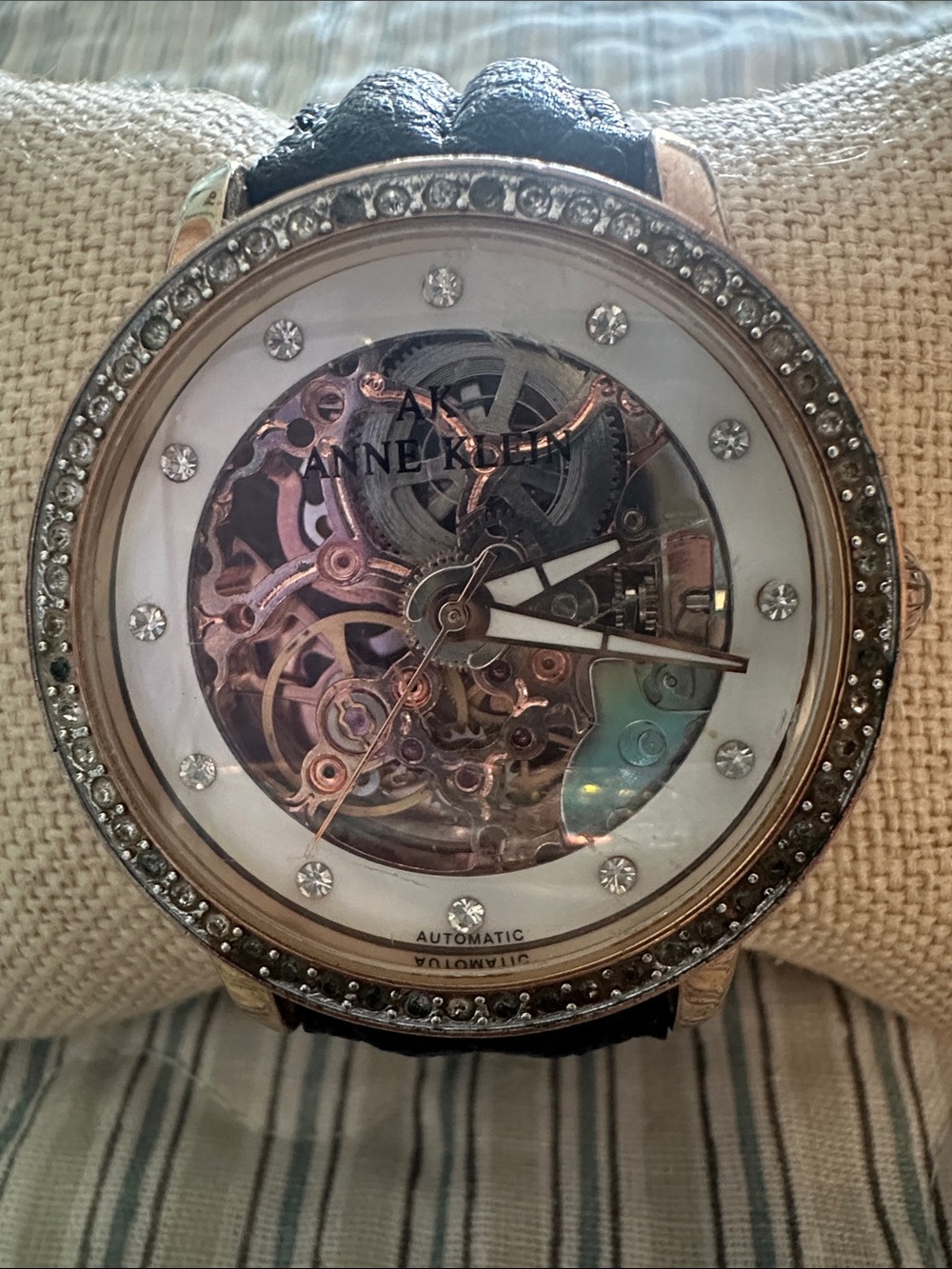 Anne Klein Rose Gold Skeleton Watch with Crystal Accents and Black Strap